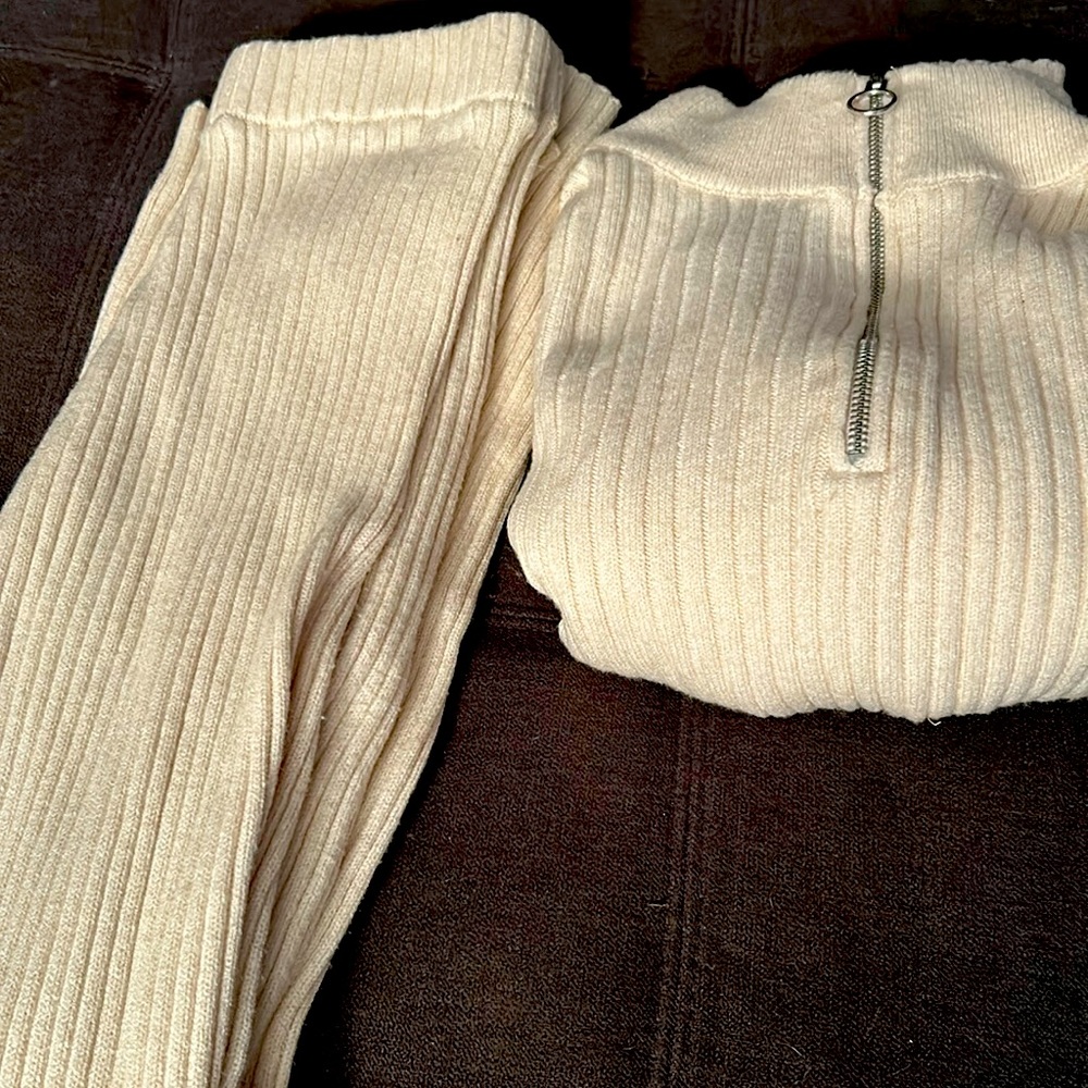 Two piece outfit, very comfy, warm, and stretchy. Pants have slight flare.